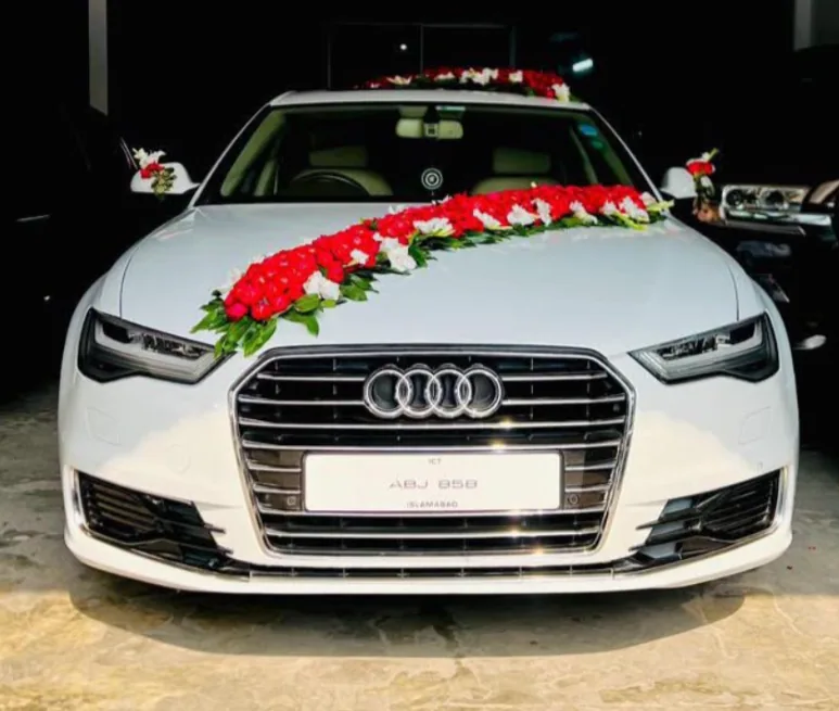 White Audi A6 decorated for a wedding event