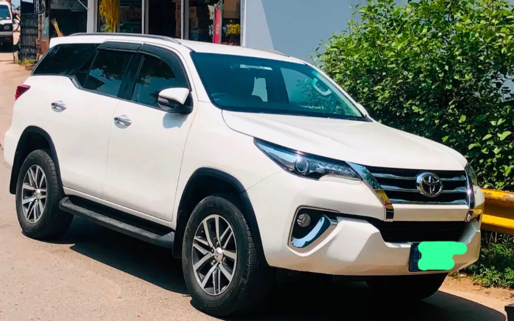 White Toyota Fortuner available for in-city travel